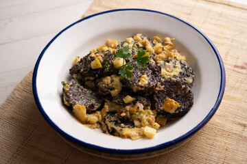 Revuelto de morcilla. Scrambled eggs with blood sausage. Typical Spanish recipe.