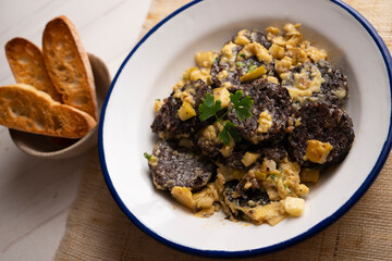 Revuelto de morcilla. Scrambled eggs with blood sausage. Typical Spanish recipe.
