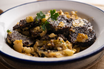 Revuelto de morcilla. Scrambled eggs with blood sausage. Typical Spanish recipe.