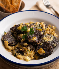 Revuelto de morcilla. Scrambled eggs with blood sausage. Typical Spanish recipe.