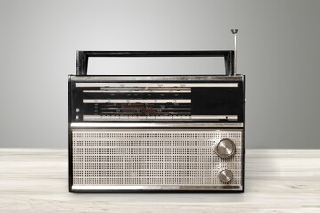 Old dark radio, retro radio on background. Vintage radio on the desk