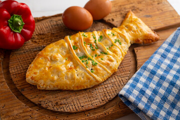 Puff pastry in the shape of a fish stuffed with tuna.