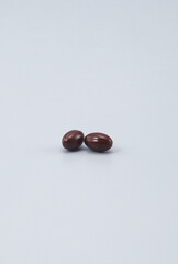 a supplement that promises to improve your health -Softgel Capsules , pill , tablets ..