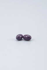 a supplement that promises to improve your health -Softgel Capsules , pill , tablets ..