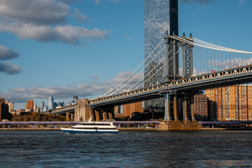 Fototapeta premium View of Manhattan Bridge on a overcast spring day - New York City. Manhattan bridge Spans East river In New York City. The Manhattan Bridge, New York City. Awesome wideangle upward view.