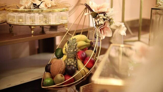 Golden basket decorated with fruits for henna(Xina) day Baku, Azerbaijan