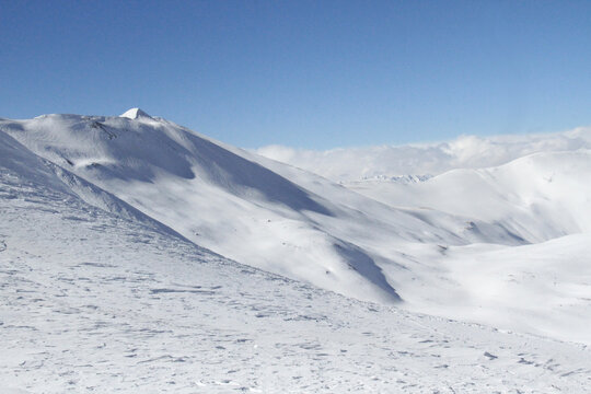 The winter landscape of snow covered Tochal mountains. It is a ski resort located on the Alborz mountain range, adjacent to the metropolitan area of Tehran, Iran.
