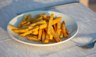 French fries in a plate on a table