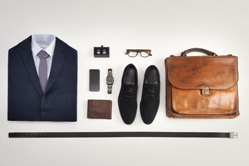 Flatlay of business suit, corporate formal attire with fashion accessories on a white table...