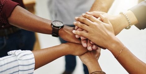 Diverse people stacking or piling hands in teamwork, success and support to show solidarity, trust...