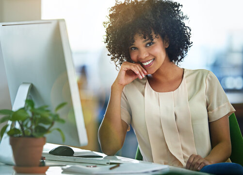 Successful, Happy And Confident Business Woman Sitting At Computer At Desk With A Positive Mindset. Beautiful, Healthy Female Entrepreneur Or Innovative, Trustworthy Leader Smiling While Working.