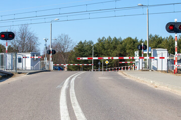 Railroad crossing with traffic lights and abandoned barriers. Safety. Poland Masovia