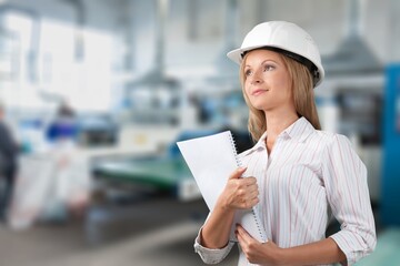 Happy women engineer worker enjoy working in factory industry.