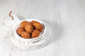 Kukis keju gula aren or Palm cheese cookies are cookies made from flour, granulated sugar, parmesan cheese, and wrapped in palm sugar.