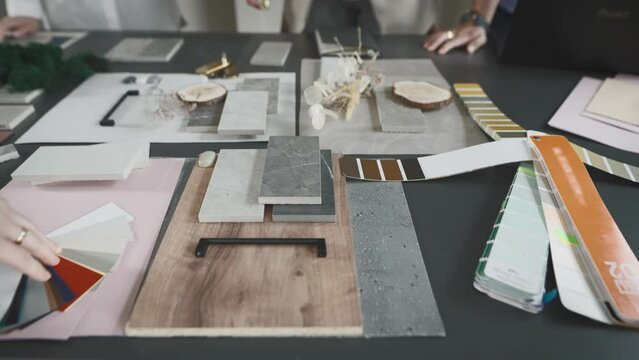 Creative studio solutions for interior design. Designers, men and women, choose combinations of surfaces and textures.
