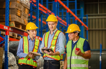 Workers team working in warehouse, Manager and supervisor taking inventory in warehouse, Foreperson making plans with team in factory warehouse