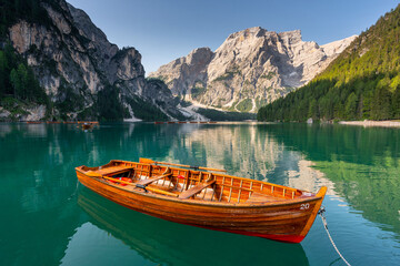 Amazing Sunrise view of Lago di Braies (Pragser Wildsee) with Wooden boats, one of the most...