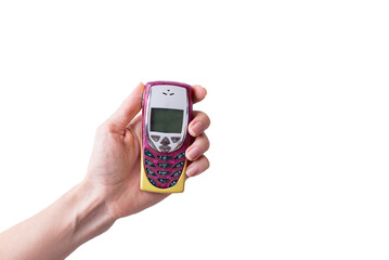 Retro mobile phone in hand isolated on white background.