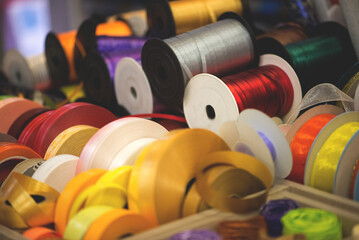 multicolored gift ribbons wrapped in rolls