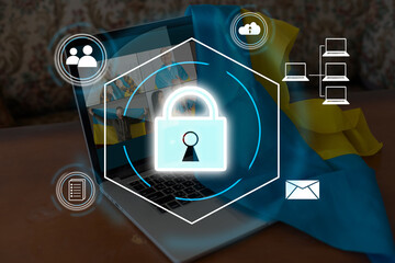 Technology concept with cyber security internet and networking, laptop, screen padlock icon on digital display. flag of Ukraine