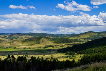 Scenic view of mountains, forests and valleys from mountain peak