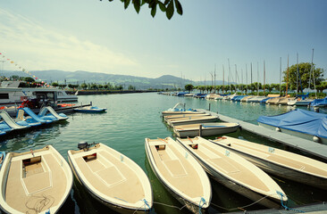 Harbor with leisure moored boats at town promenade.