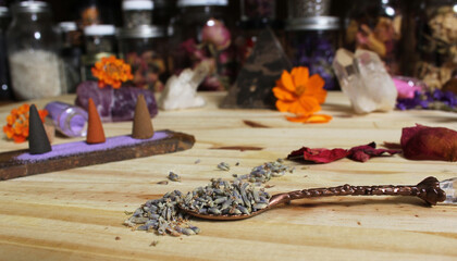 Dried Lavender and Rose Petals on Table With Incense Cones and Crystals