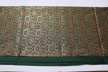 women Traditional Green and Gold Colour Saree Isolated on White Background