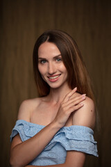 Fototapeta na wymiar studio portrait on a dark background of a beautiful young woman