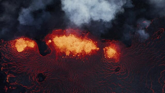 Top down view of active fissure volcano with hot molten lava spewing on earth surface