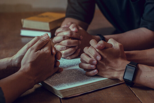Christian Bible Study Concepts. Group of Christian read and study the bible together in a home. followers are studying the word of God and worship in church..