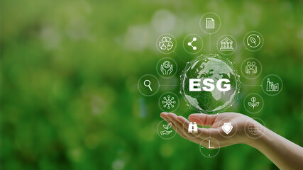 ESG icon concept in the woman hand for environmental, social, and governance by using technology of...