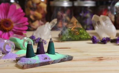 Incense Cones on Stone Slab With Crystals and Flowers