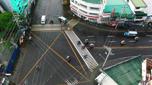Top down aerial view rain water flooded the highways all over the Dagupan City, Philippines