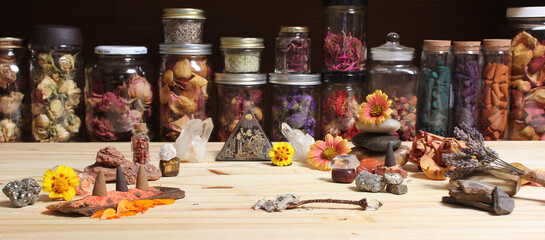 Meditation Altar With Rock Crystals and Flowers. Jars of Herbs in Background