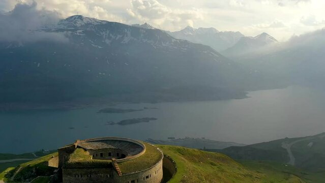 Aerial Time Lapse Shot Of Fort De Ronce On Green Hill, Drone Flying Forward During Winter Season - Val-Cenis, France