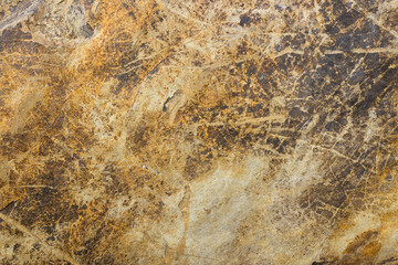 Natural stone background with golden veins. Granite slab stone, rustic matt texture