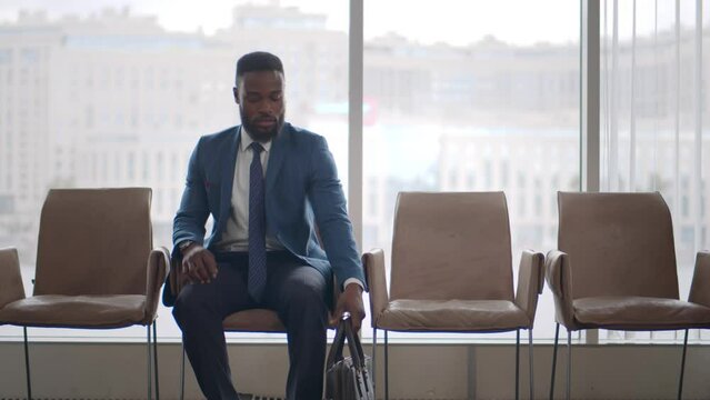 African-American businessman wait for appointment with business partner. Realtime