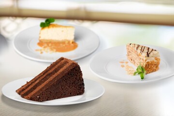 Composition with assorted cakes. Set of dessert. Pieces of cakes
