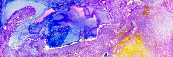 Yellow and light golden dust and drops on pink and blue Alcohol ink fluid abstract texture fluid art with gold glitter and liquid.