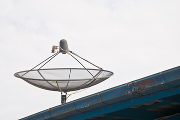Modern satellite dishe on the roof top in cloudy day