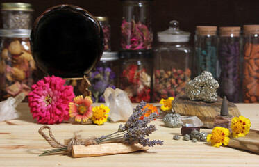 Meditation Altar With Rock Crystals and Flowers. Jars of Herbs in Background