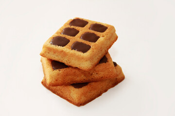 sweet baked belgian waffles with chocolate on a white background