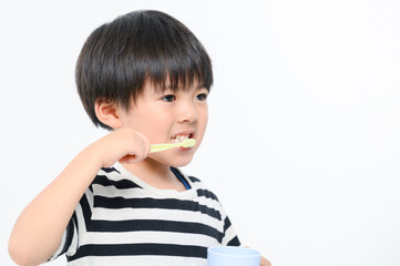 Close-up of a child brushing his teeth
