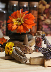 Flowers and Incense Cone With Palo Santo Sticks on Meditation Table