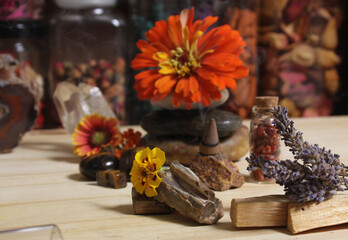Flowers and Incense Cone With Palo Santo Sticks on Meditation Table
