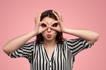 Curious lady pouting lips and gesturing eyeglasses