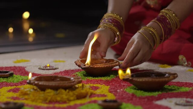 Traditional diya lamps lit during diwali celebration.
