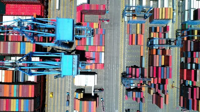 Aerial Top Panning Shot Of Multi Colored Cargo Containers At Port, Drone Flying On Sunny Day - Valpara�so, Chile