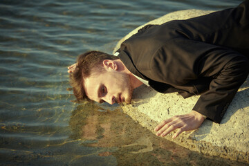 man looking at reflection